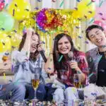 two-young-couples-singing-at-a-birthday-party