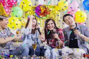 two young couples singing birthday party
